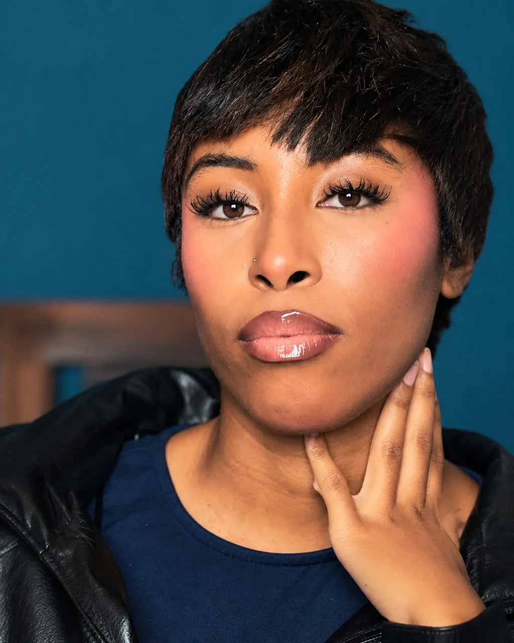 Beauty tutorial featuring a makeup portrait with blush and glossy lip